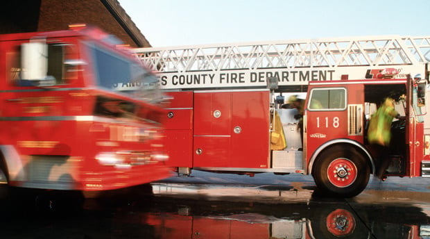 fire trucks rolling out of a fire station