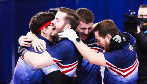 Curling team celebrating