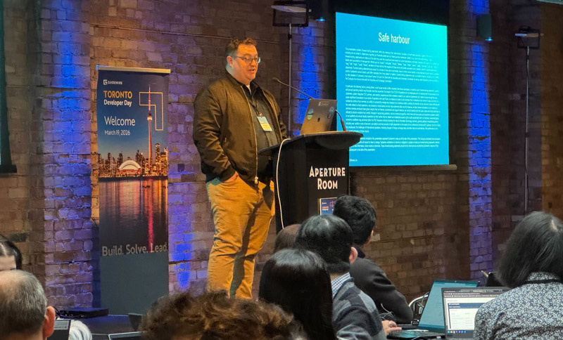 speaker addressing a group of event attendees