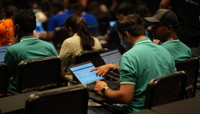 Developers at work on laptops