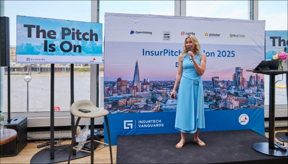 Laura Drabik on stage speaking at InsurPitch 2025 London