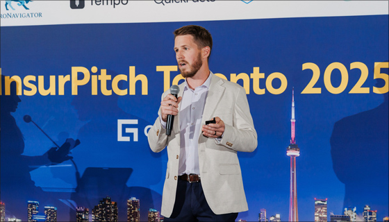 Man on stage at InsurPitch Toronto 2025