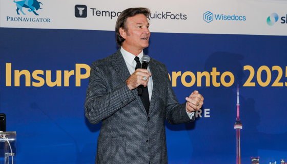 Man on stage at InsurPitch Toronto 2025