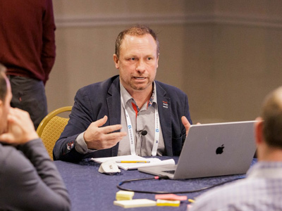 Men at table having a discussion