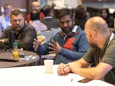 Men at table having a discussion