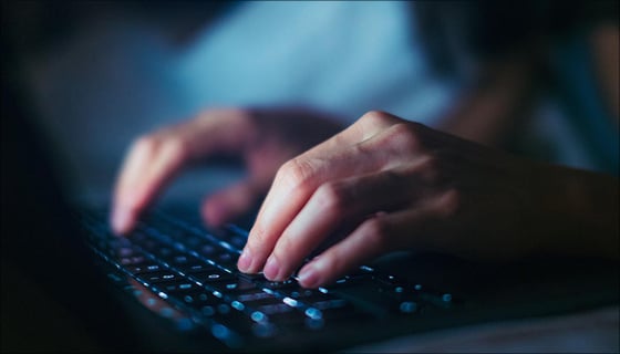 hands on a computer keyboard