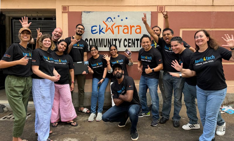 13 persons on Guidewire team celebrating at the Ek Tara Community Center