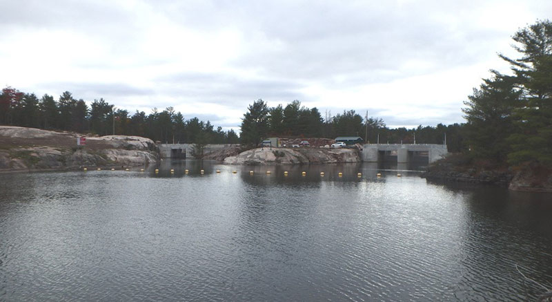 View of the Big Chaudière Dam, with its south and north channels on the right and the Portage Dam on the left