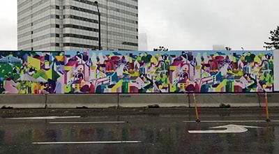 The construction site fencing is now showcasing the work of Toronto-based artist, Wenting Li
