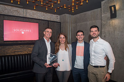 Hatch committee members receive the 'Coup de cœur', Mobilization prize at Centraide's Solidaires Awards gala. From left: Pierre Carpentier, Marie Drinkwater, William Hupke (Centraide) and Thierry Barbaud.