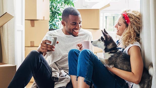 New homeowner’s sitting in new house