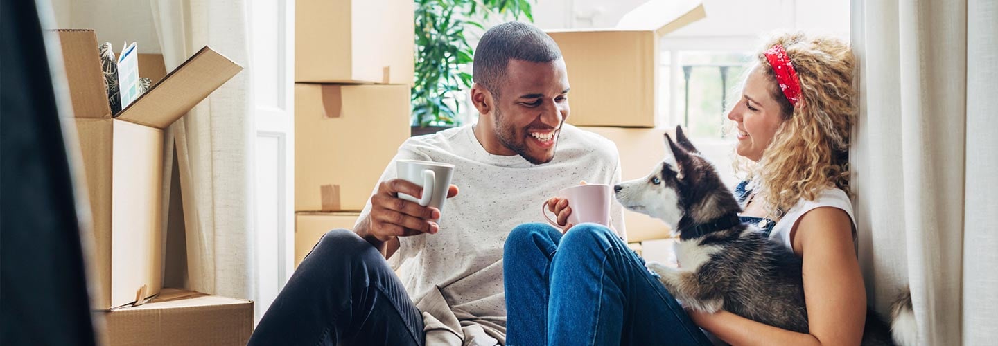 New homeowner’s sitting in new house