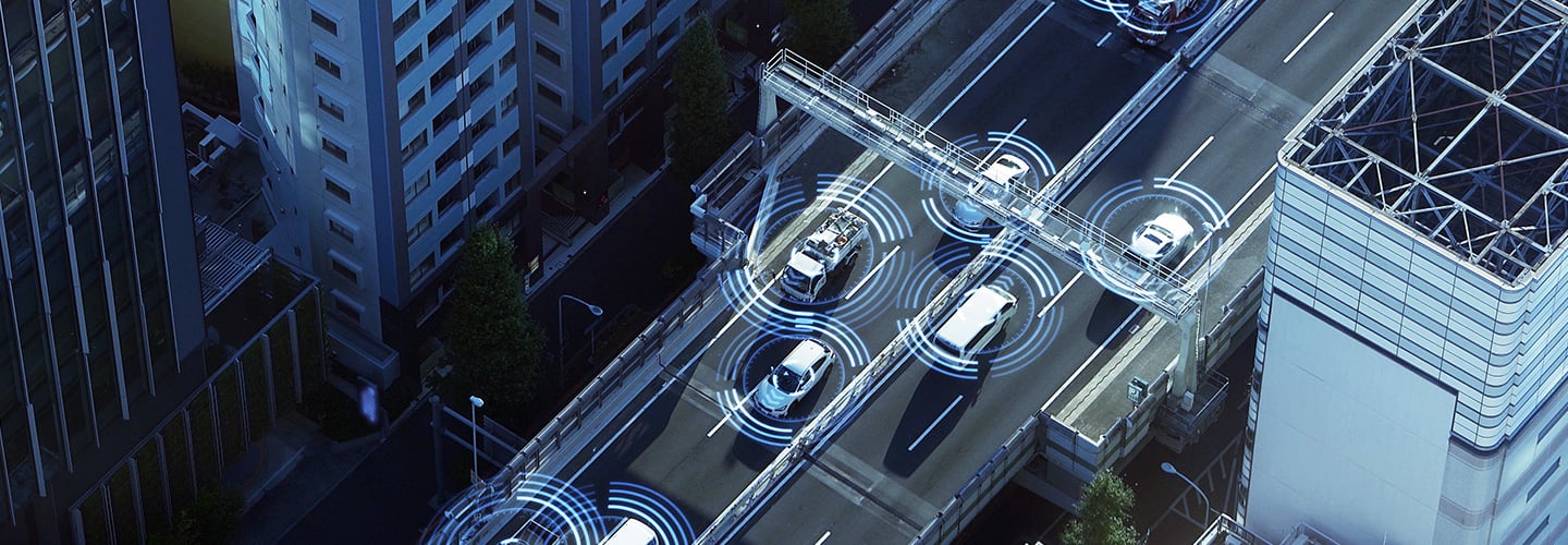 ariel view of smart cars driving on a highway in the city
