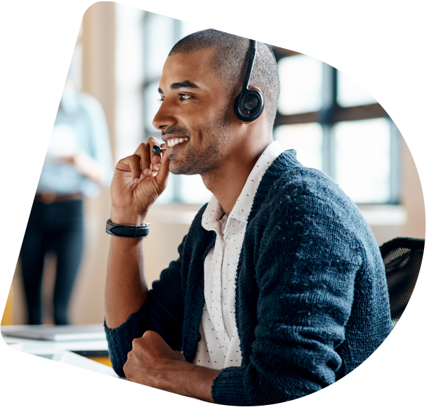 A support agent helping a customer on the phone.