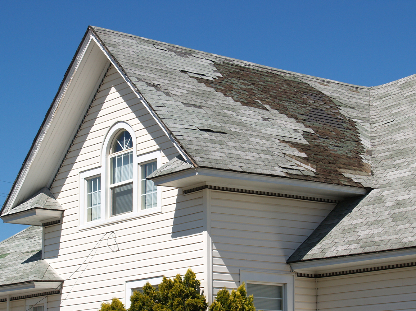 A house with a damaged roof.