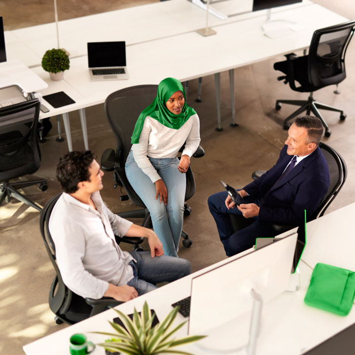 Three people having a conversation