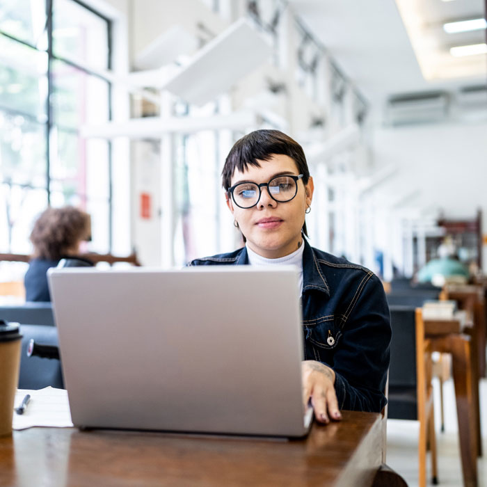 A woman working on a laptop