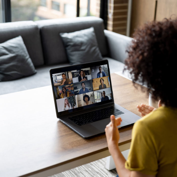 A woman having a virtual meeting on a laptop