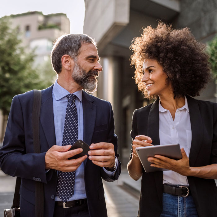 A man and a woman walking while having a conversation