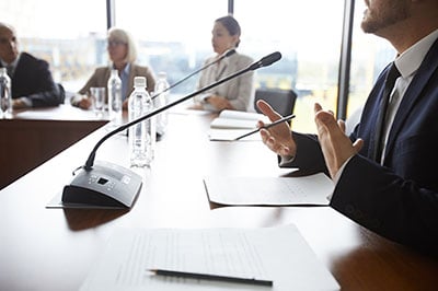 Photo of a person speaking at Conerence 