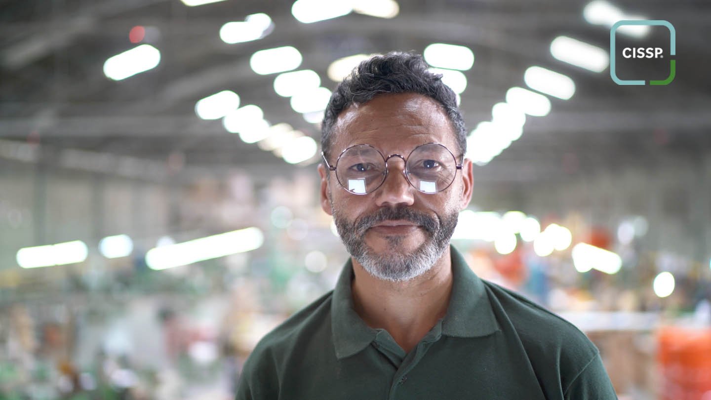 A man with glasses staring at the camera