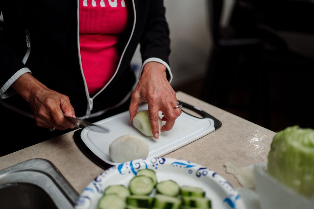 Mary Johnson cutting an onion