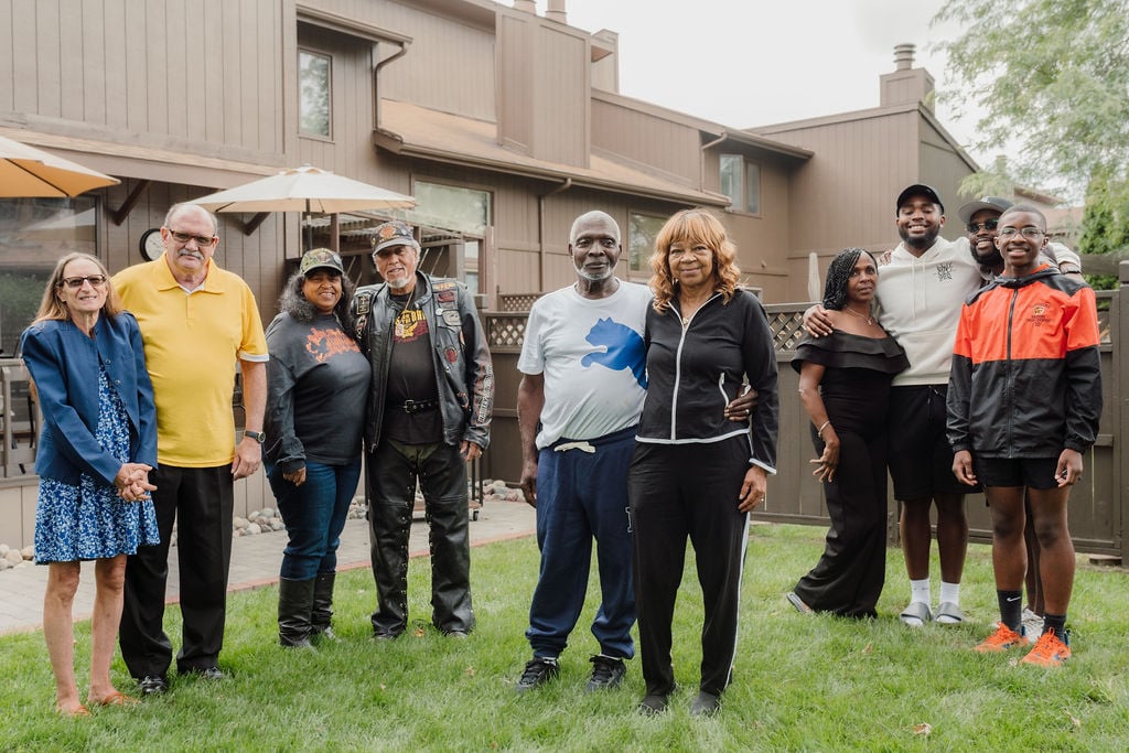 Mary and Frank Johnson surrounded by friends and family