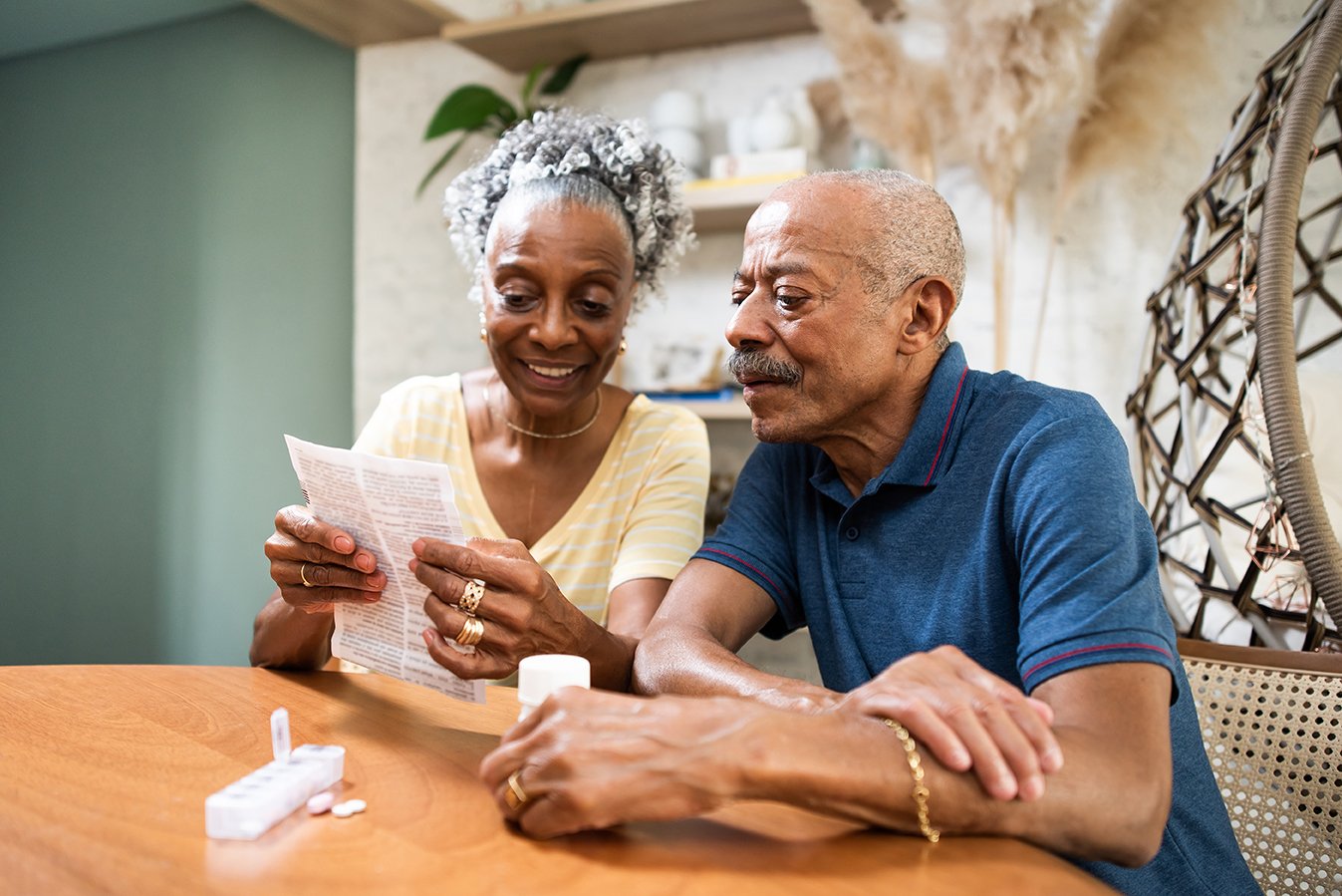 Woman showing man paperwork