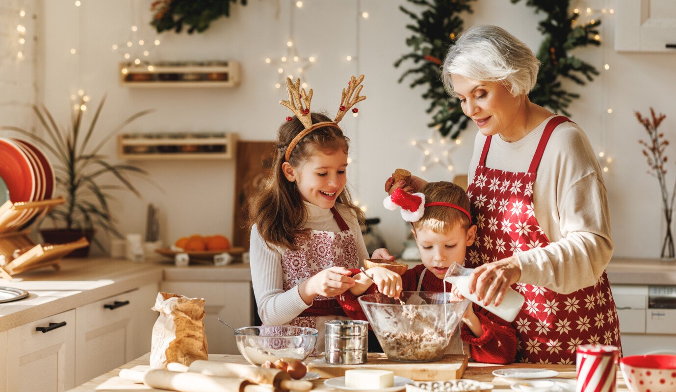 Grandmother baking cookies with grandkids