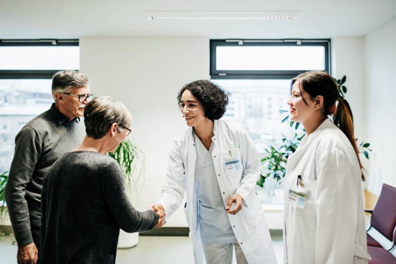 Doctors greeting patients