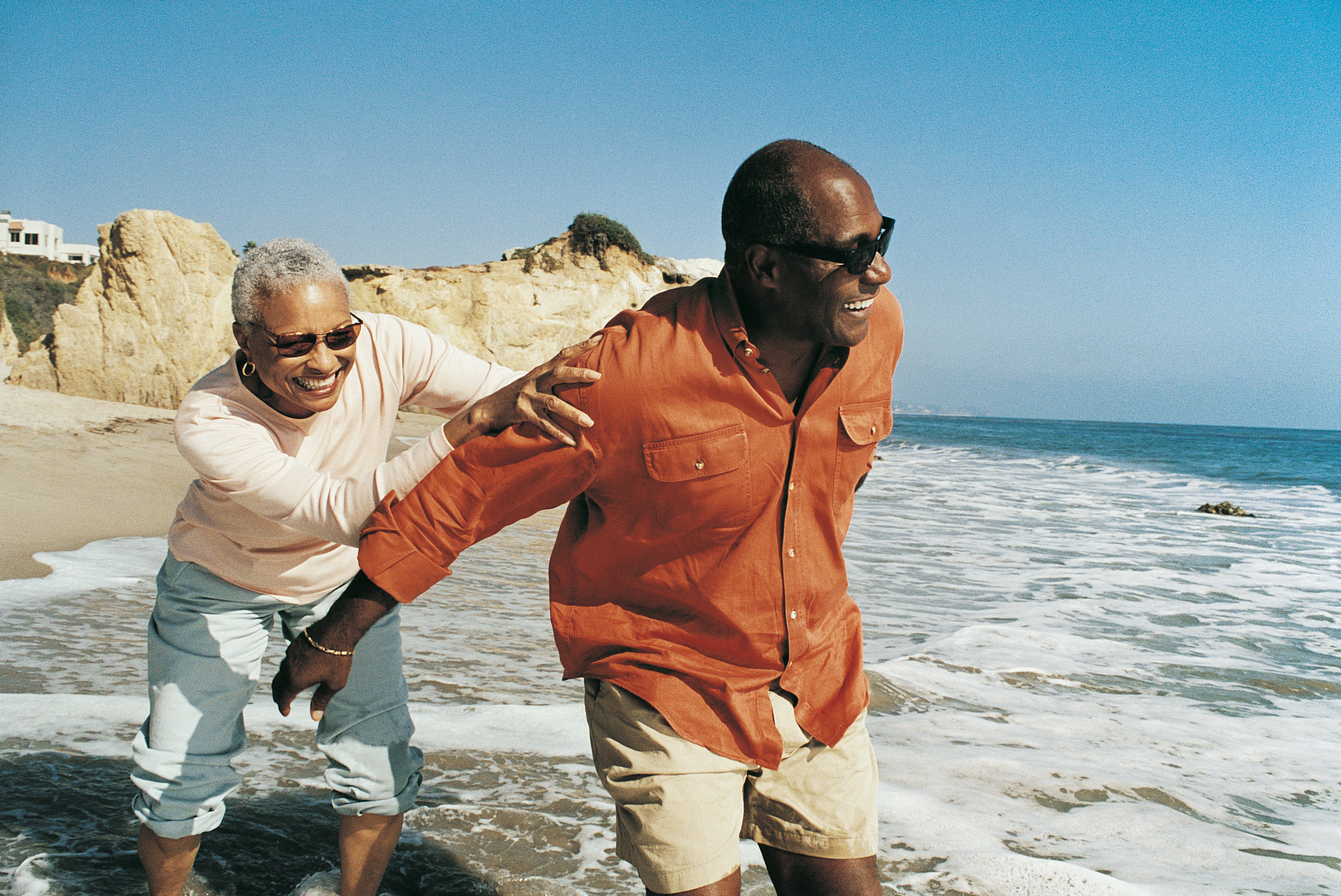 couple taking a walk by the ocean