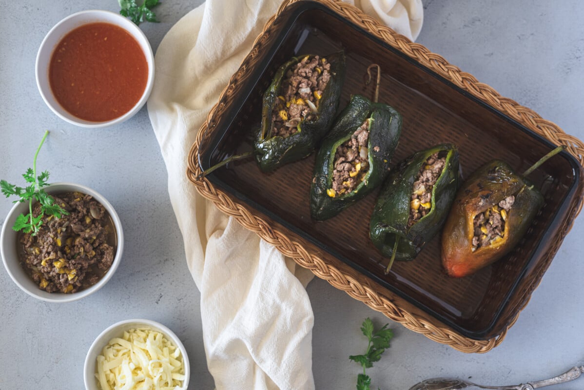 Poblano stuffed Chile with meat and cheese in tomato sauce