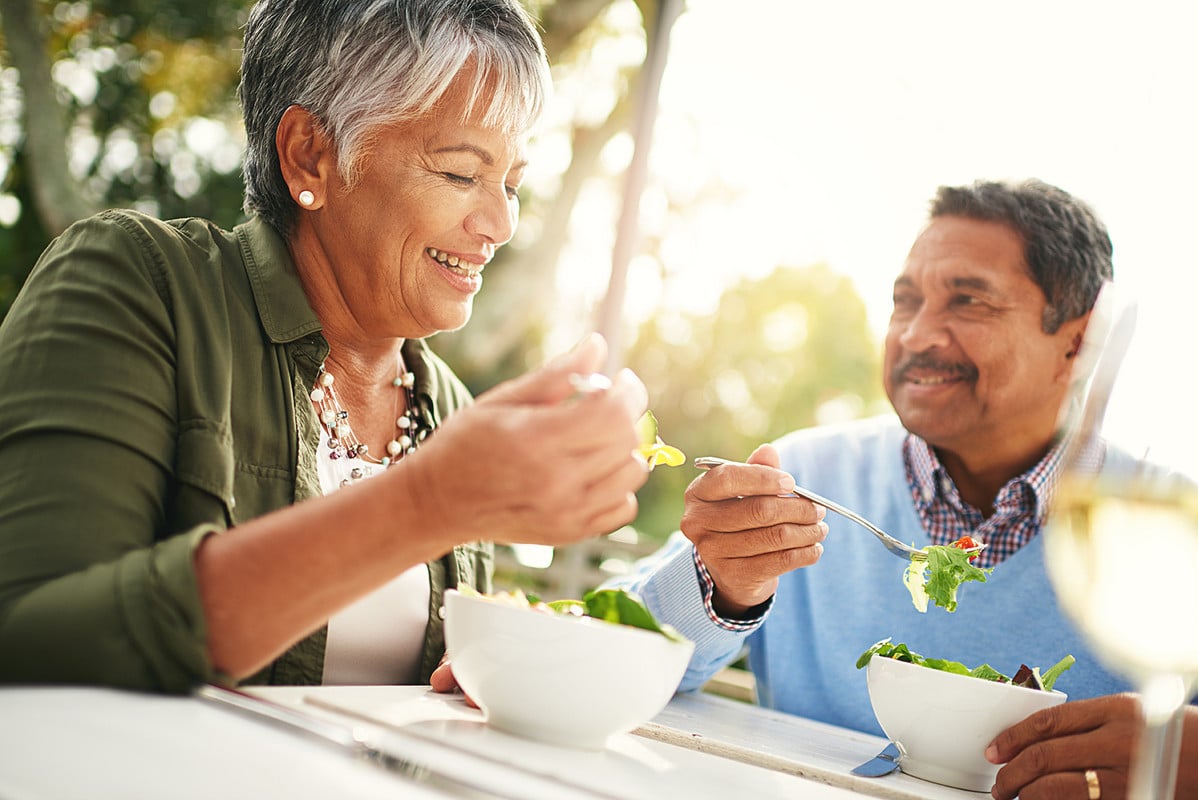 Latino Man and woman enjoy a healthy meal together