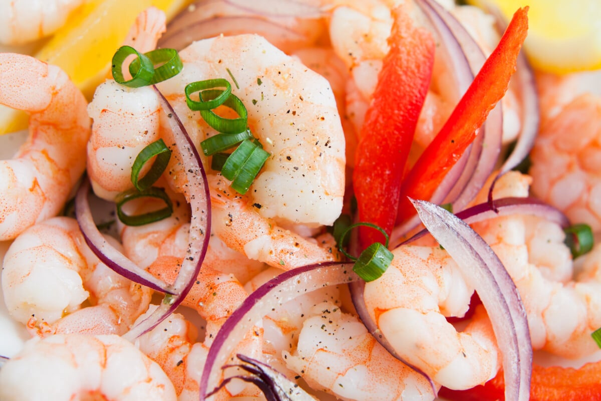 Seafood ceviche, king prawns, lemon, lime, juice, spring onions, chives and spicy chili red peppers