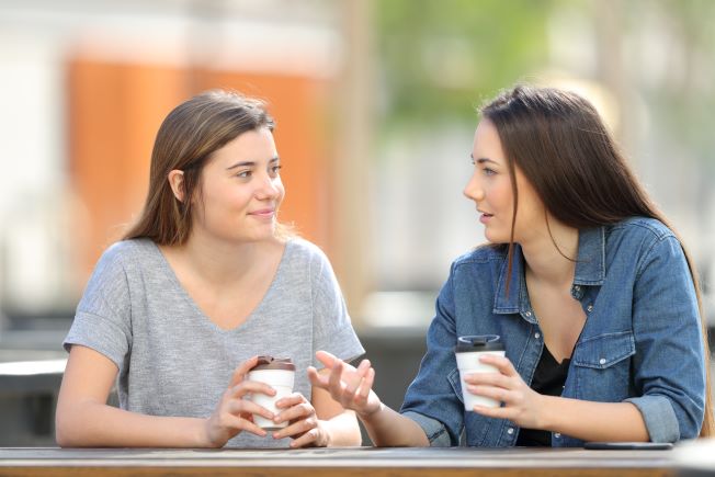 Two women talking over coffee