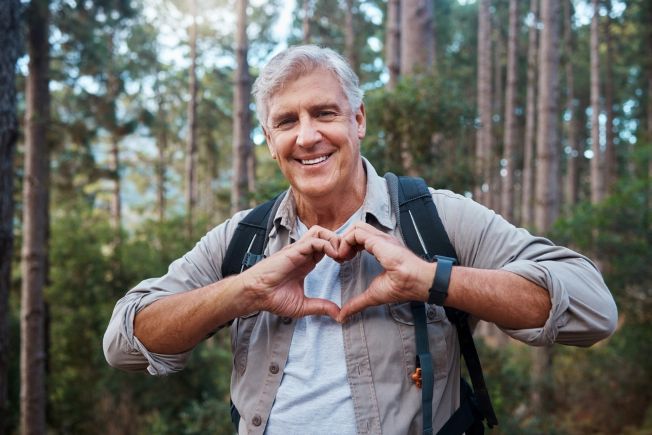 Man making heart symbol with hands