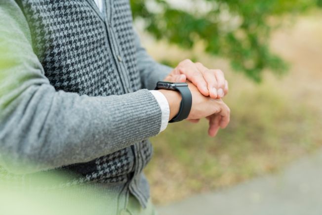 Older man's arm showing his smartwatch