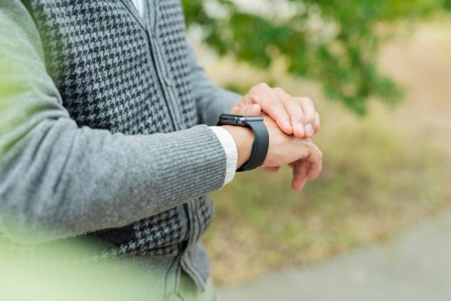 Older man's arm showing his smartwatch