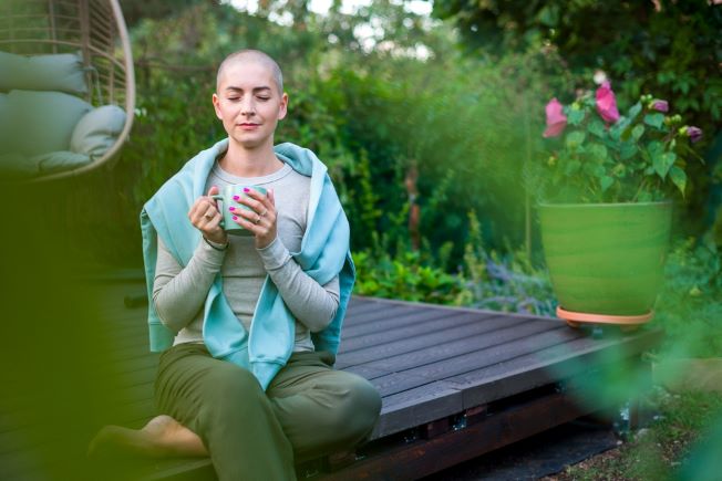 Woman outside meditating