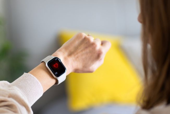 Woman checking heart rate on watch