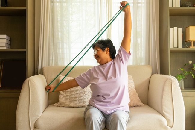 Woman exercising on couch
