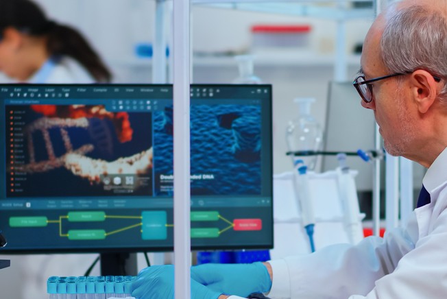 Male researcher looking at images