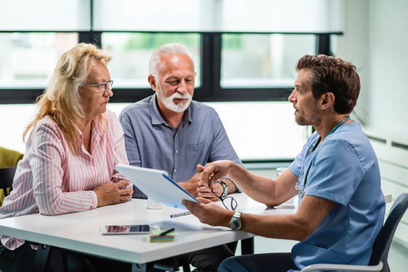 A married couple meeting with a physician