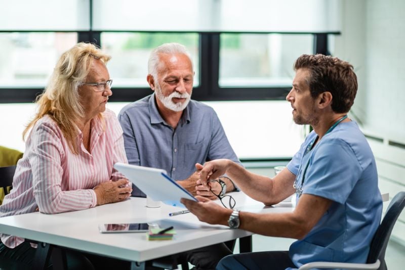 A married couple meeting with a physician