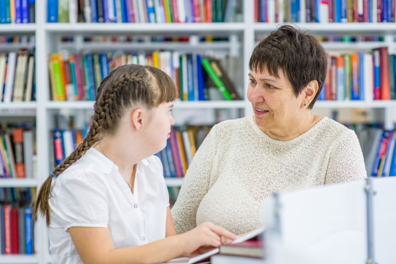Teacher working with student