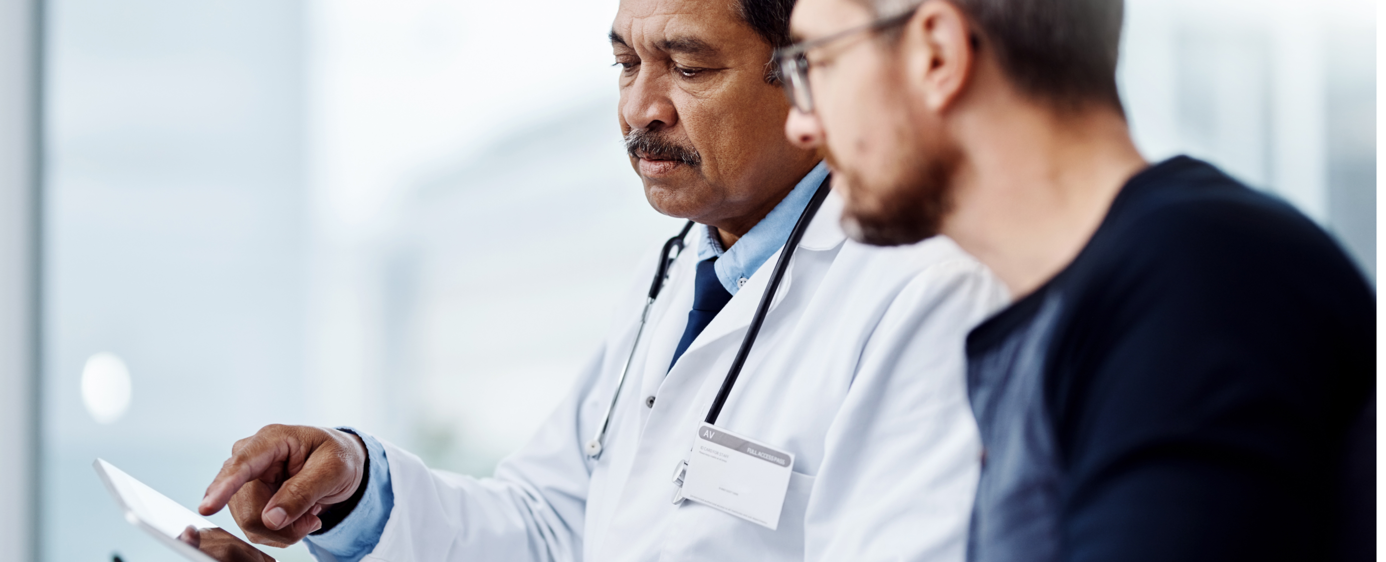 Male doctor with male patient