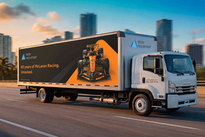 McLaren partnership branded Iron Mountain truck driving in the sunset