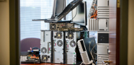 old IT assets stacked on office desk