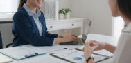 financial advisor showing paperwork to client