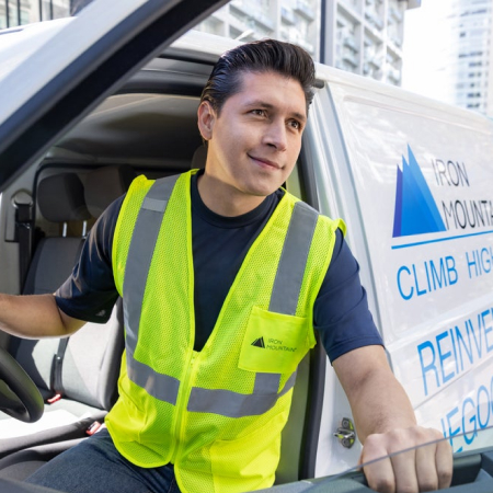IM worker exiting IM truck